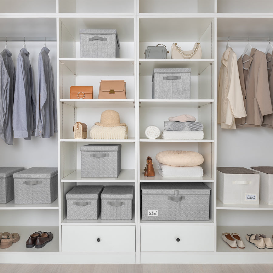 Organized closet shelving with fabric storage bins